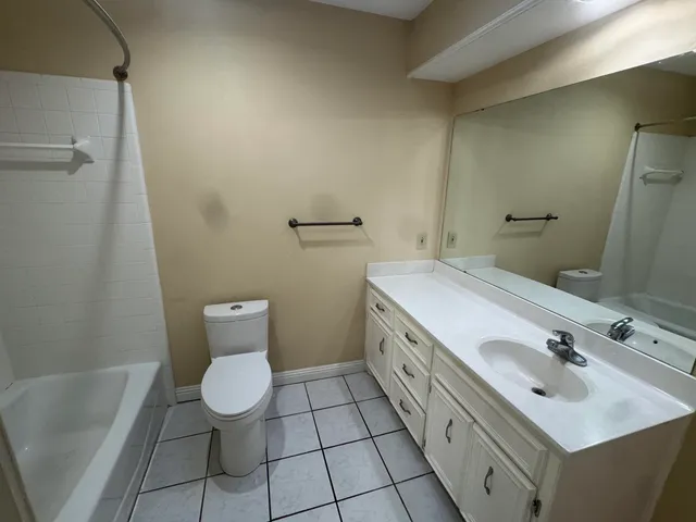 a bathroom with a sink toilet and tub