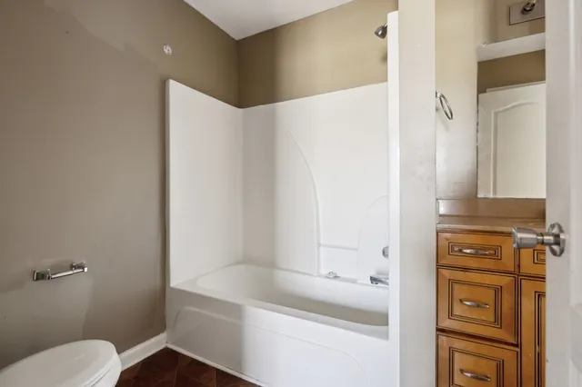 a bathroom with a bathtub and a sink