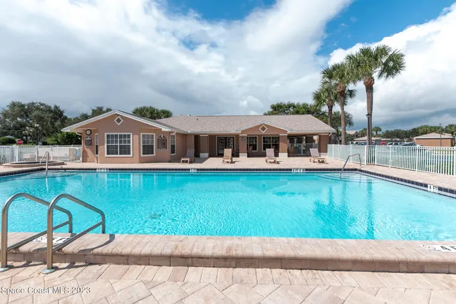 a view of a chair and tables in patio of the house