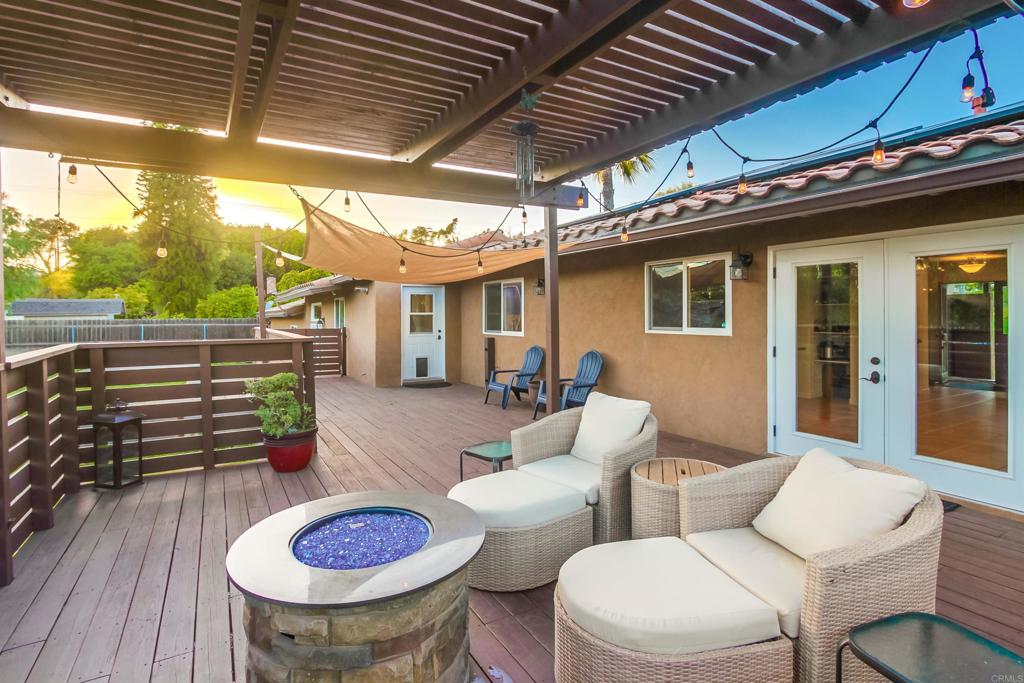 1321 Friends Way Fallbrook, CA 92028 - Photo 23 of 71 a view of a patio with table and chairs and potted plants