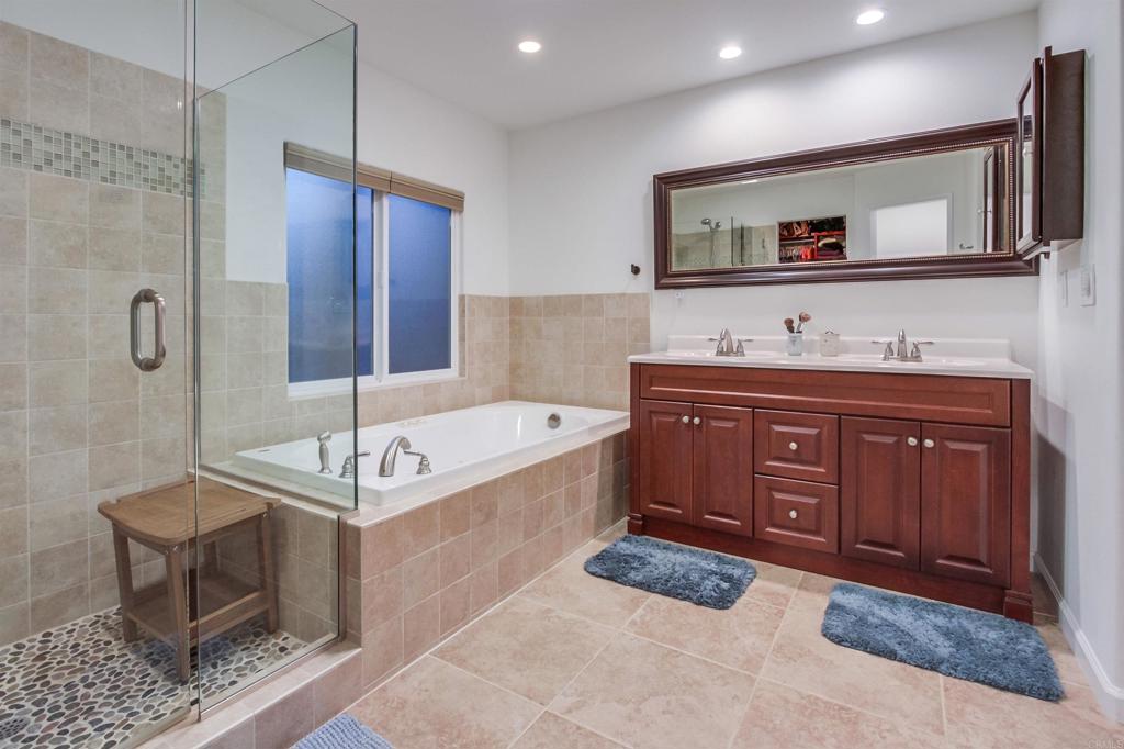 1321 Friends Way Fallbrook, CA 92028 - Photo 34 of 71 a spacious bathroom with a tub sink and mirror