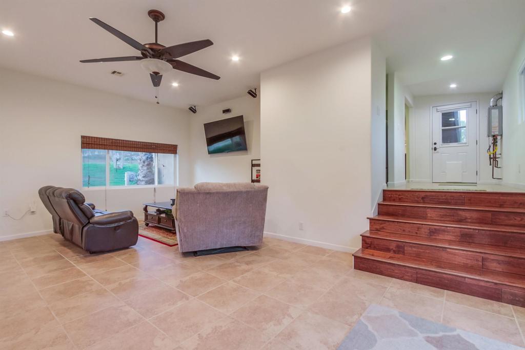 1321 Friends Way Fallbrook, CA 92028 - Photo 37 of 71 a living room with furniture and a large window