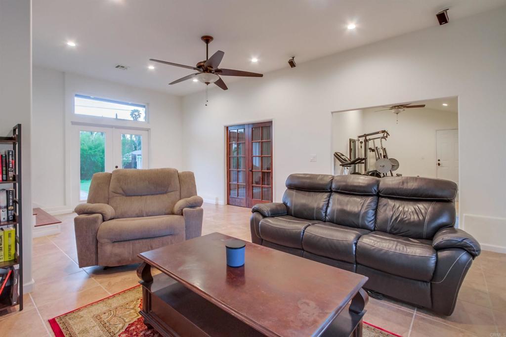 1321 Friends Way Fallbrook, CA 92028 - Photo 39 of 71 a living room with furniture a ceiling fan and a rug