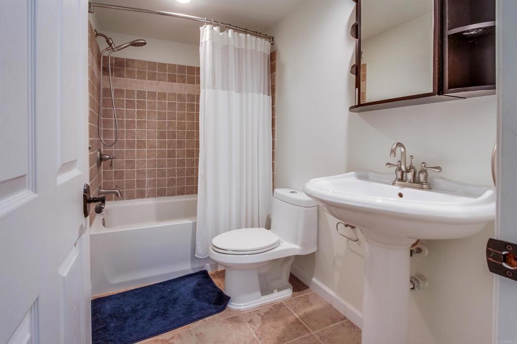 1321 Friends Way Fallbrook, CA 92028 - Photo 46 of 71 a bathroom with a sink toilet and shower