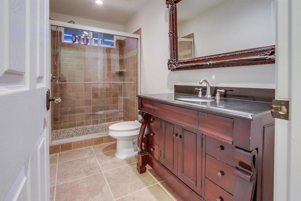 1321 Friends Way Fallbrook, CA 92028 - Photo 48 of 71 a bathroom with a sink a toilet and shower