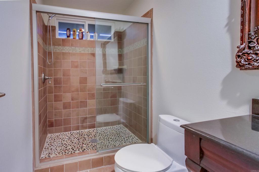 1321 Friends Way Fallbrook, CA 92028 - Photo 49 of 71 a bathroom with a toilet and a shower