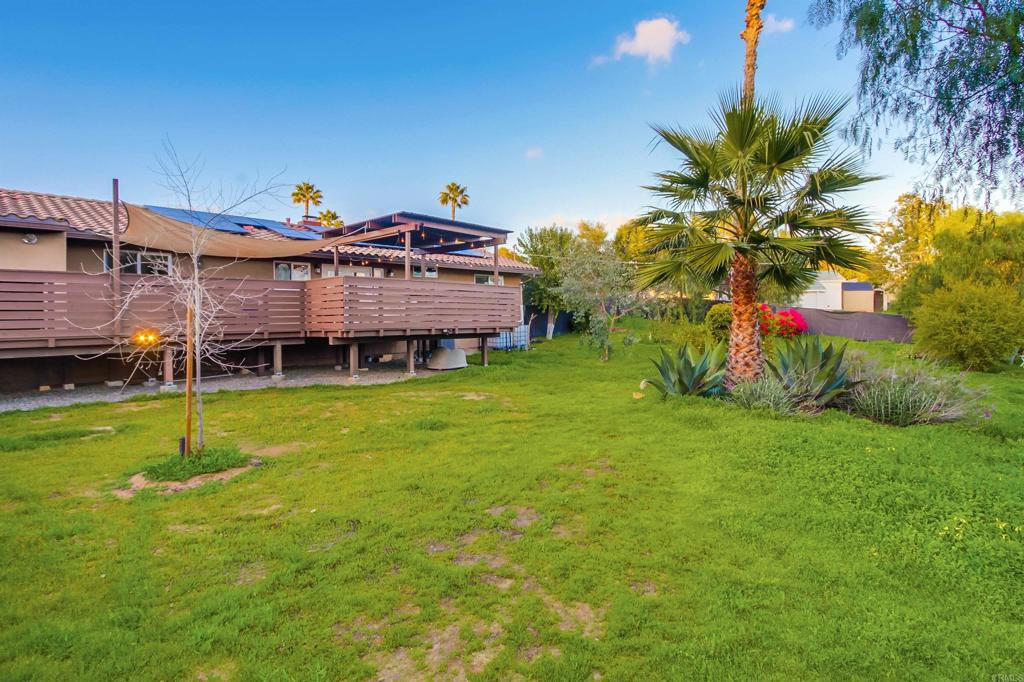 1321 Friends Way Fallbrook, CA 92028 - Photo 65 of 71 a view of a house with a backyard