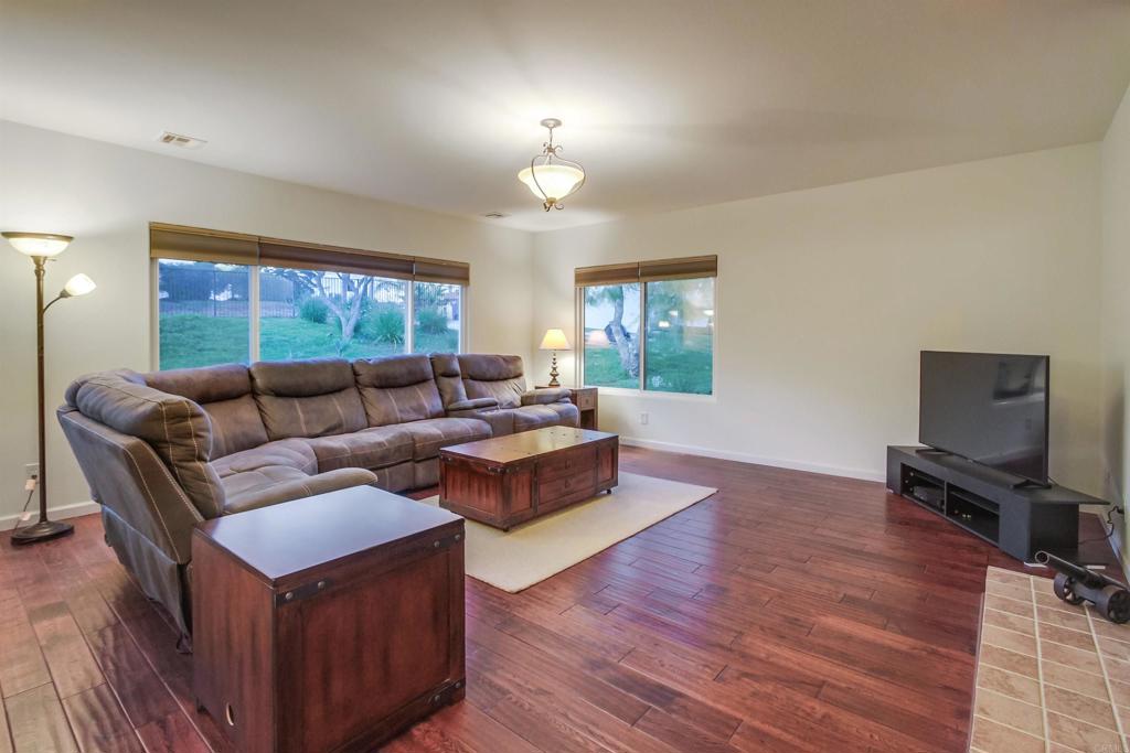1321 Friends Way Fallbrook, CA 92028 - Photo 7 of 71 a living room with furniture and a flat screen tv
