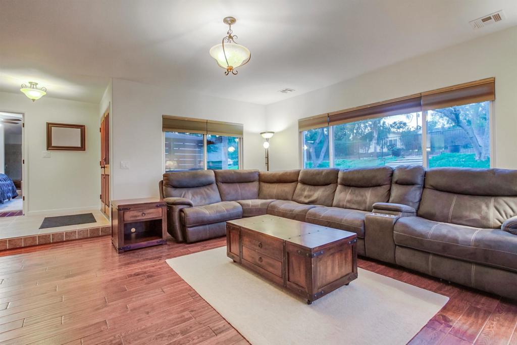 1321 Friends Way Fallbrook, CA 92028 - Photo 8 of 71 a living room with furniture and a large window