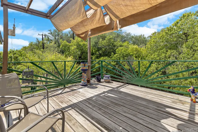 a view of a balcony with wooden floor