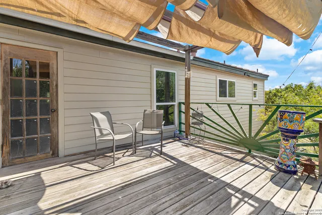 a view of a chair and table in the balcony