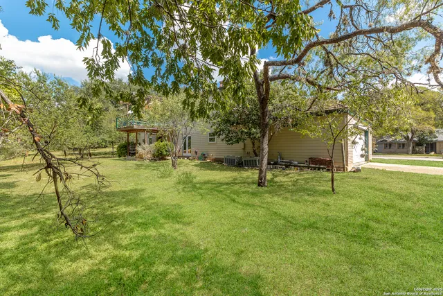 a house with trees in the background