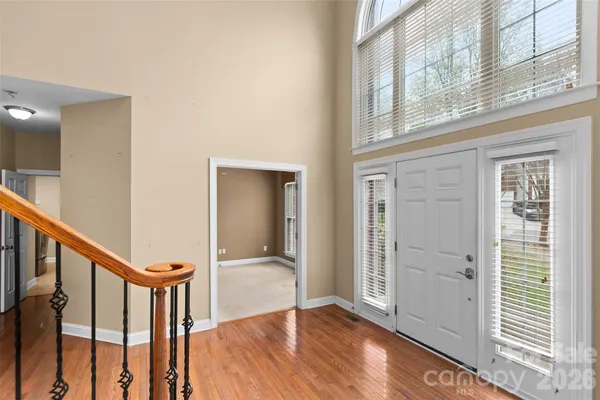a view of an entryway with wooden floor