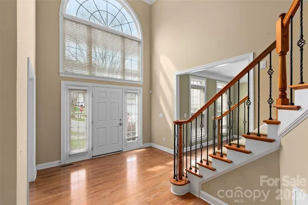 a view of an entryway with wooden floor