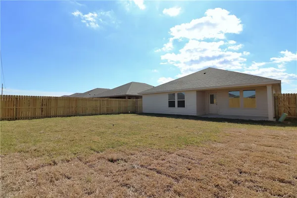 a view of an house with backyard space