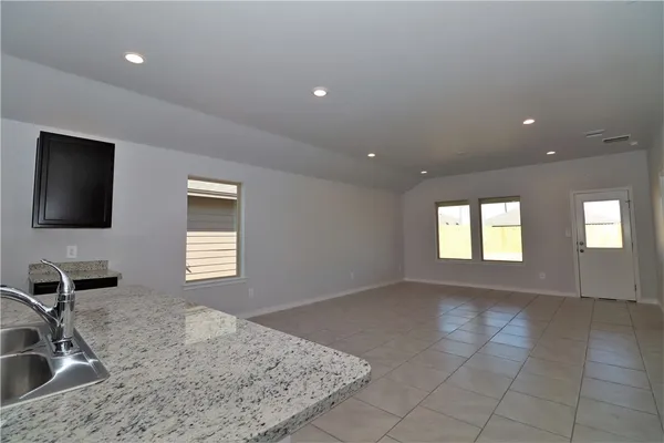 a view of a kitchen sink and a window