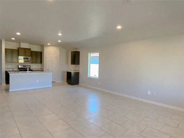 a view of a kitchen with a sink and cabinets