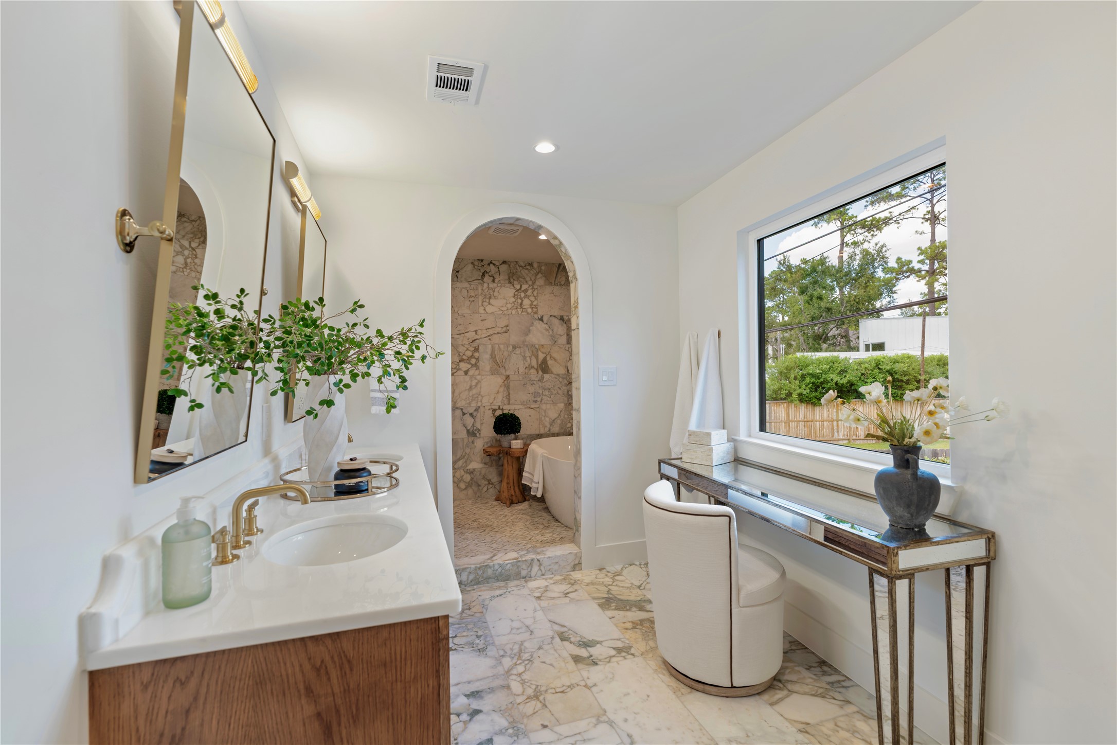 814 Azalea Street Houston, TX 77018 - Photo 12 of 31 Elegant primary bathroom featuring marble finishes, double sinks, and spa-like soaking tub