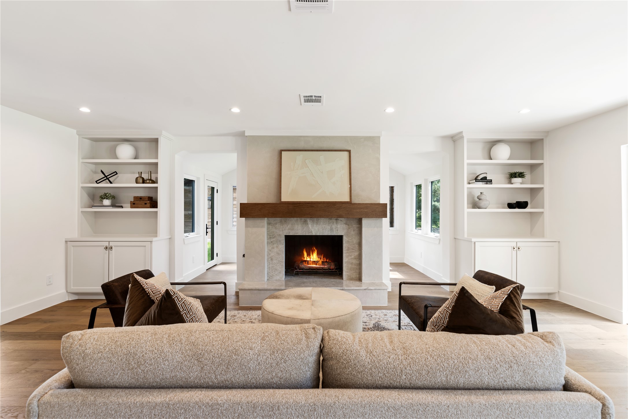 814 Azalea Street Houston, TX 77018 - Photo 5 of 31 Additional view of the living room showcasing the fireplace with wood mantel and built-in shelving
