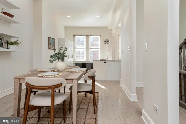 a view of a dining room with furniture and window