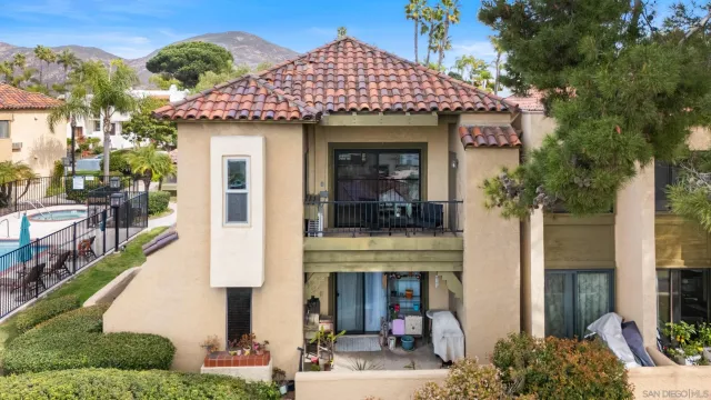 an aerial view of houses with outdoor space