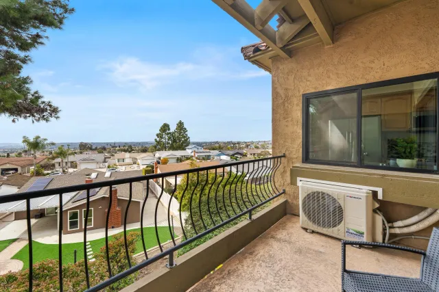 a view of a balcony with furniture