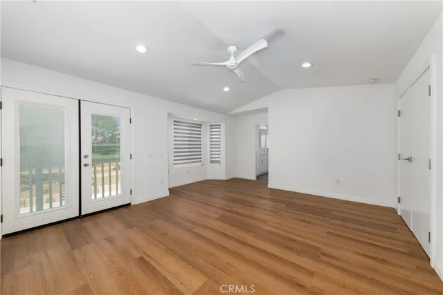a white bath tub sitting in a en suite bathroom