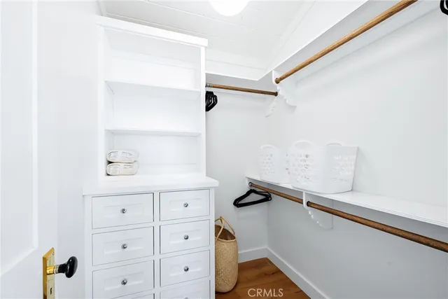 a room with a cabinets and a window