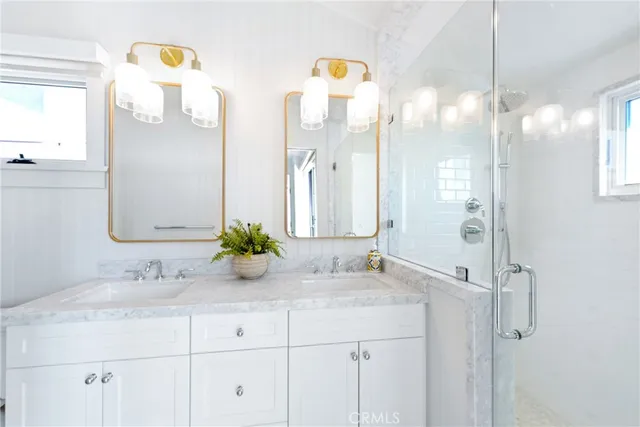 a bathroom with a sink vanity and a mirror
