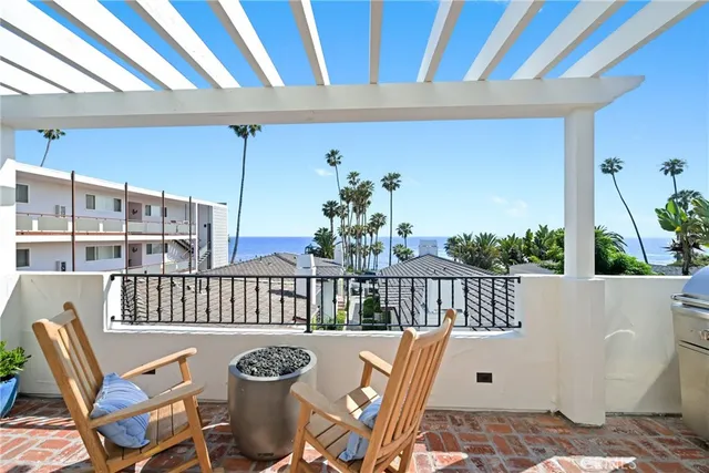 a view of a balcony with furniture