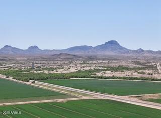 a view of a town with mountains in the background
