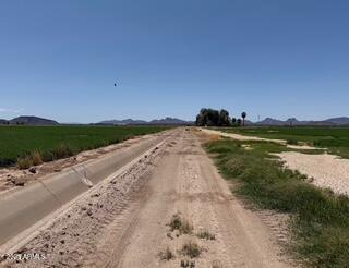 0 West Desert Rose Road Arlington, AZ 85322 - Photo 5 of 10 a view of a lake with beach and city view