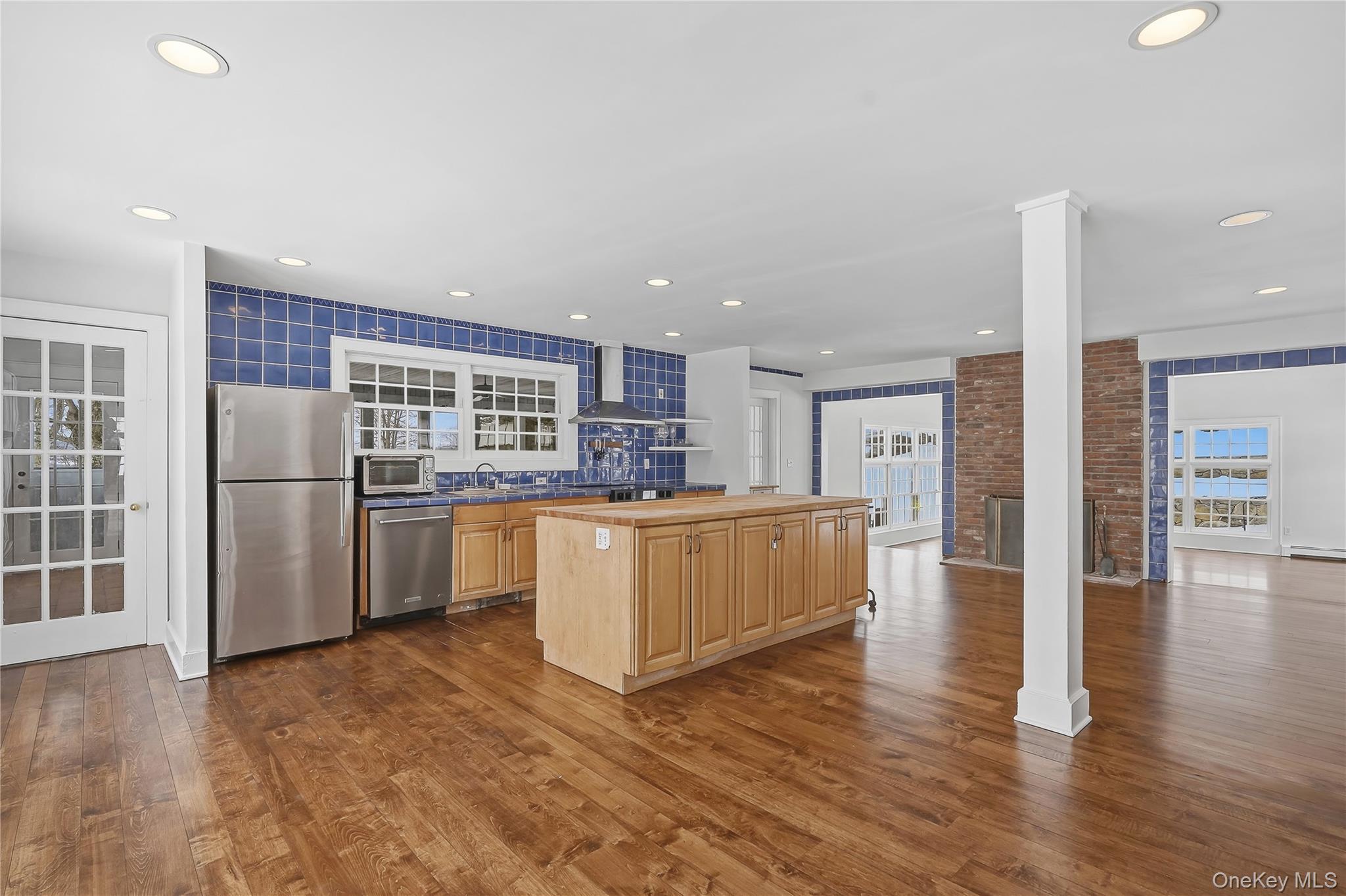 492 Mooney Hill Road, Unit 490 Patterson, NY 12563 - Photo 6 of 18 a kitchen with stainless steel appliances a refrigerator and a stove top oven