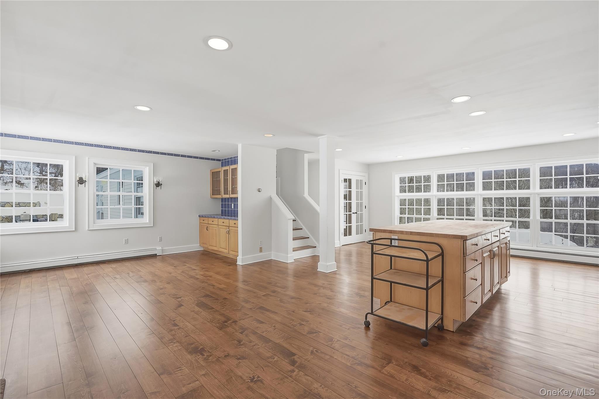492 Mooney Hill Road, Unit 490 Patterson, NY 12563 - Photo 9 of 18 a living room with furniture and a wooden floor