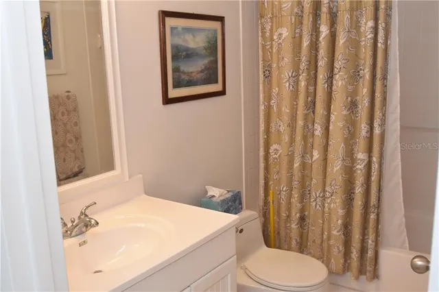a bathroom with a sink and toilet