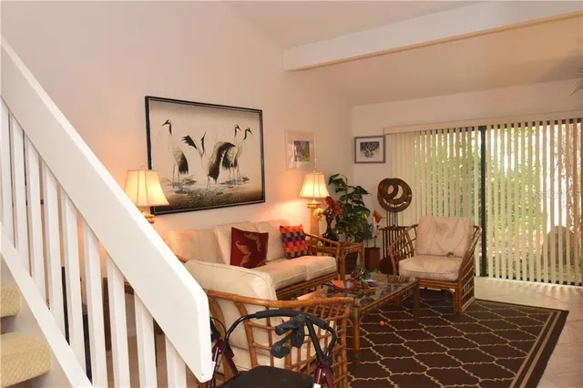 a view of a dining room with furniture and a large window