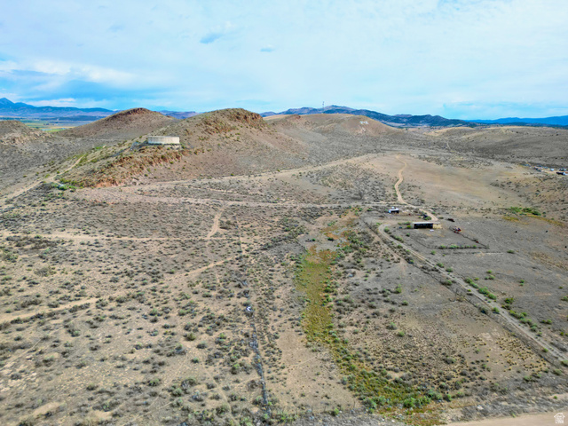 600 East E Street Moroni, UT 84646 - Photo 5 of 38 Expansive desert landscape featuring rolling hills, scattered brush, and unpaved pathways