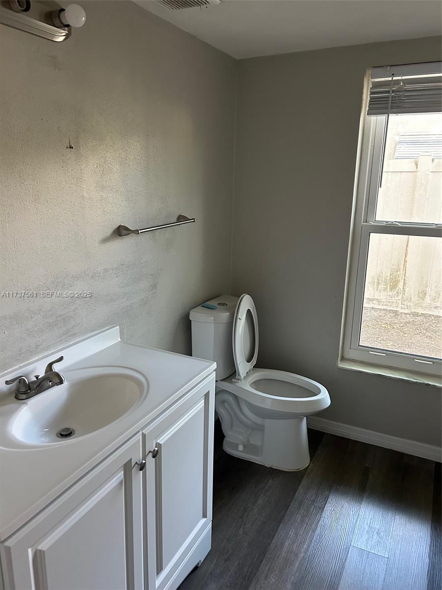 7403 Foxbloom Drive Port Richey, FL 34668 - Photo 31 of 45 a white toilet sitting next to a bathroom sink