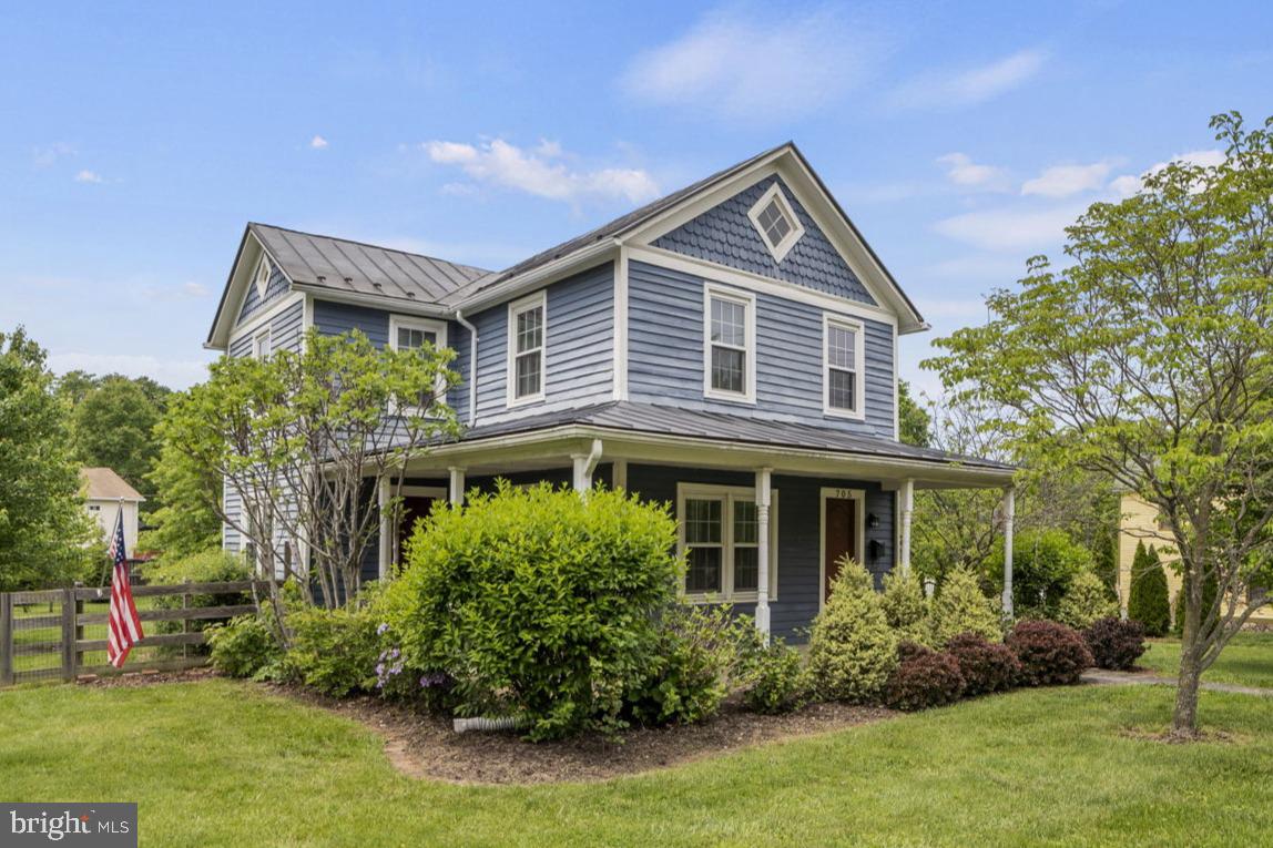 705 Dranesville Road Herndon, VA 20170 - Photo 1 of 22 Charming blue home with lush greenery.