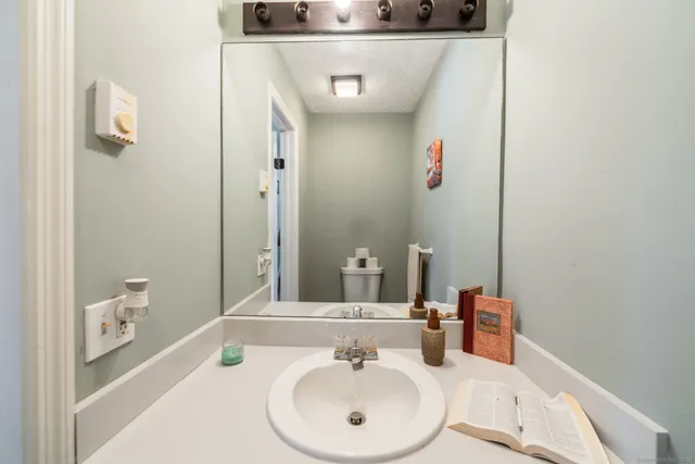 a bathroom with a sink and a mirror