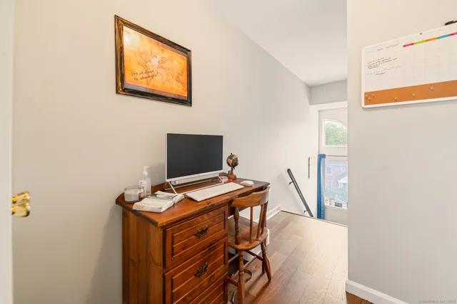 a view of a workspace with furniture
