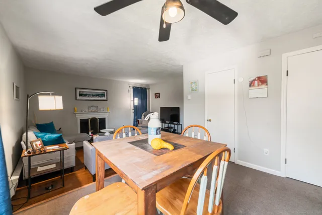 a view of a dining room with furniture and a table