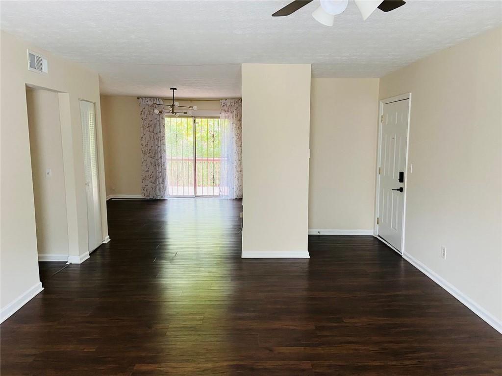 3293 Abbeywood Drive Decatur, GA 30034 - Photo 12 of 56 a view of an empty room with wooden floor and a window
