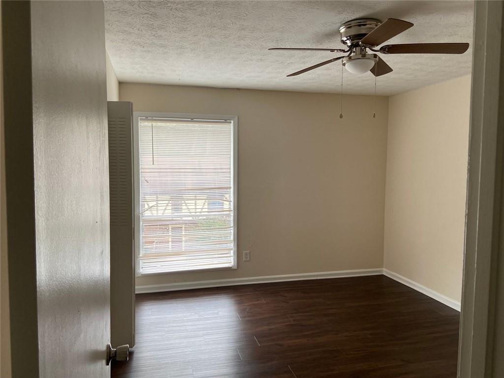 3293 Abbeywood Drive Decatur, GA 30034 - Photo 14 of 56 a view of room with hardwood floor and a ceiling fan