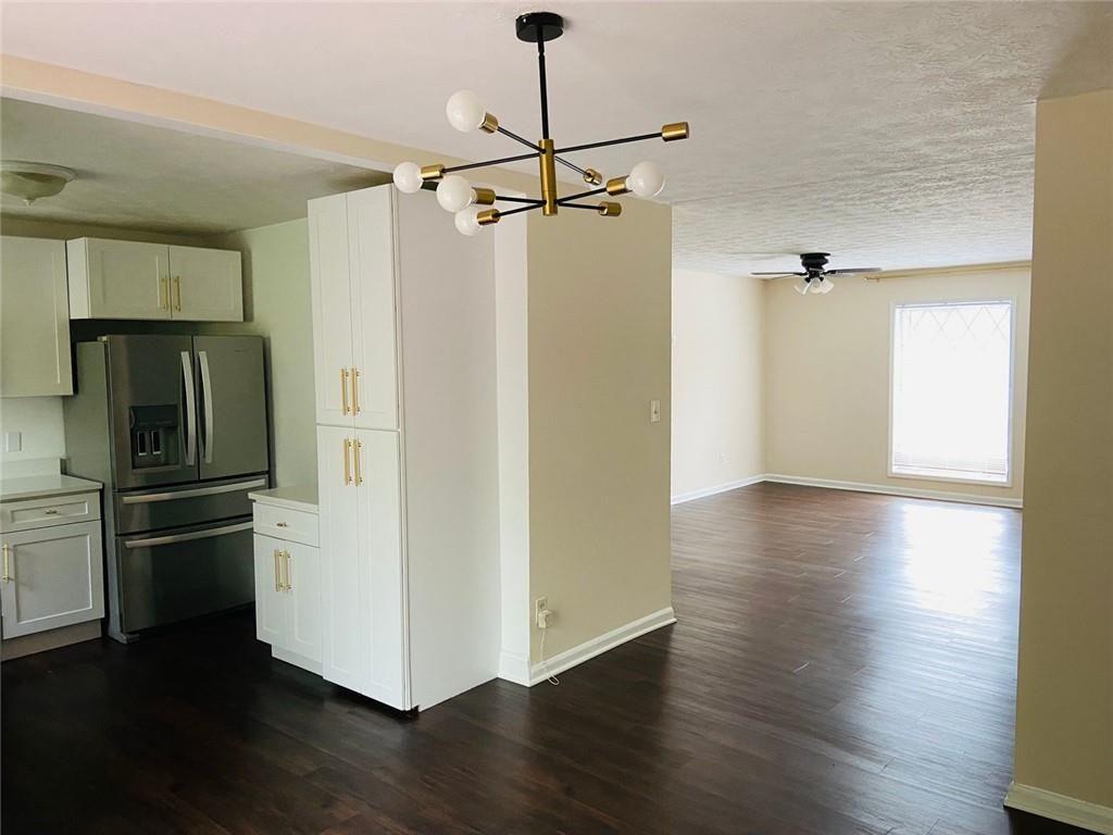 3293 Abbeywood Drive Decatur, GA 30034 - Photo 17 of 56 a view of a kitchen with a refrigerator and wooden floor