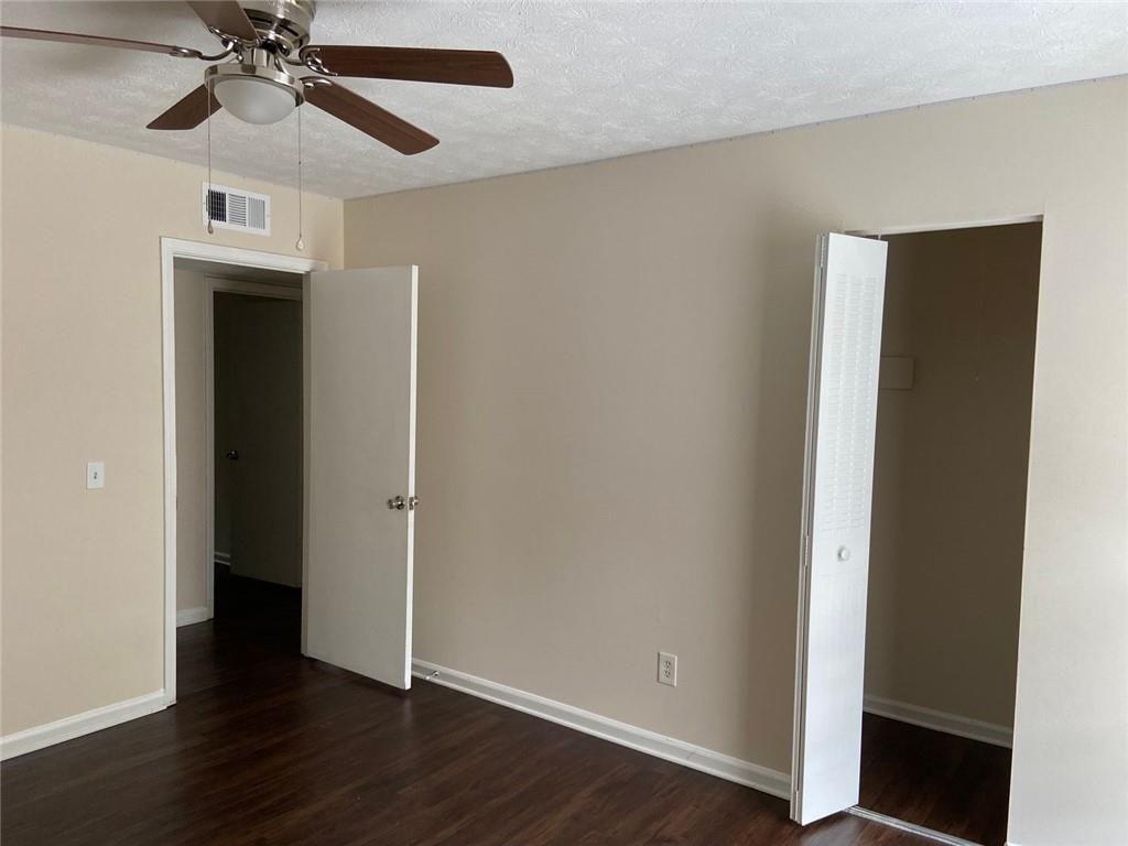 3293 Abbeywood Drive Decatur, GA 30034 - Photo 31 of 56 an empty room with wooden floor closet and windows