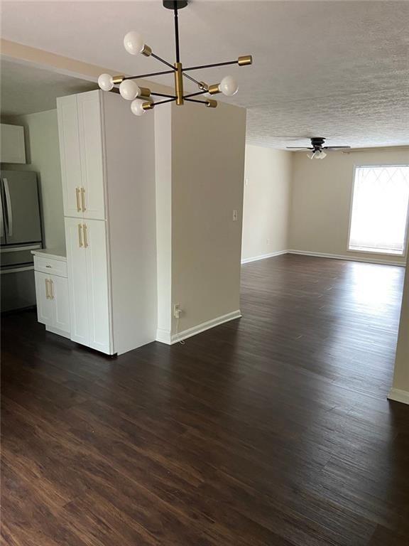3293 Abbeywood Drive Decatur, GA 30034 - Photo 4 of 56 a view of a room with wooden floor electronic appliances and a window