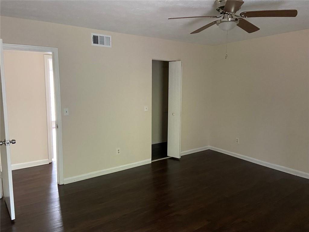 3293 Abbeywood Drive Decatur, GA 30034 - Photo 41 of 56 a view of a room with wooden floor and a ceiling fan