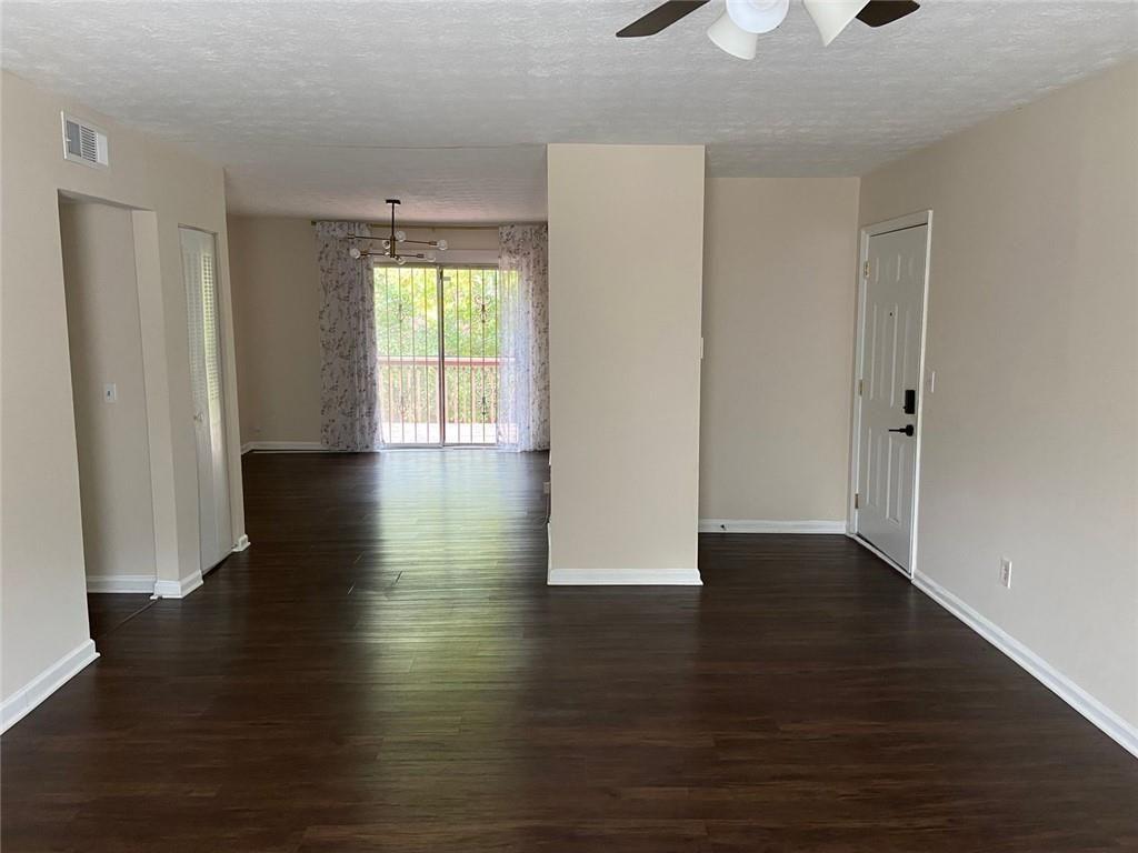3293 Abbeywood Drive Decatur, GA 30034 - Photo 5 of 56 a view of an empty room with wooden floor and a window
