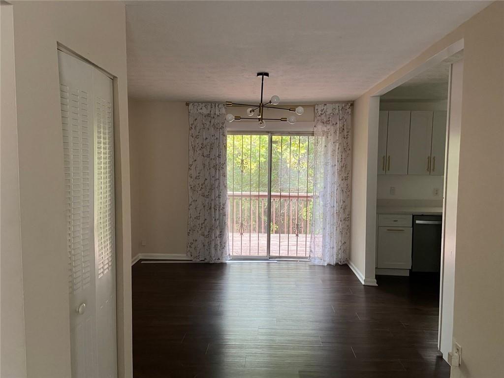 3293 Abbeywood Drive Decatur, GA 30034 - Photo 7 of 56 a view of an empty room with wooden floor and a window